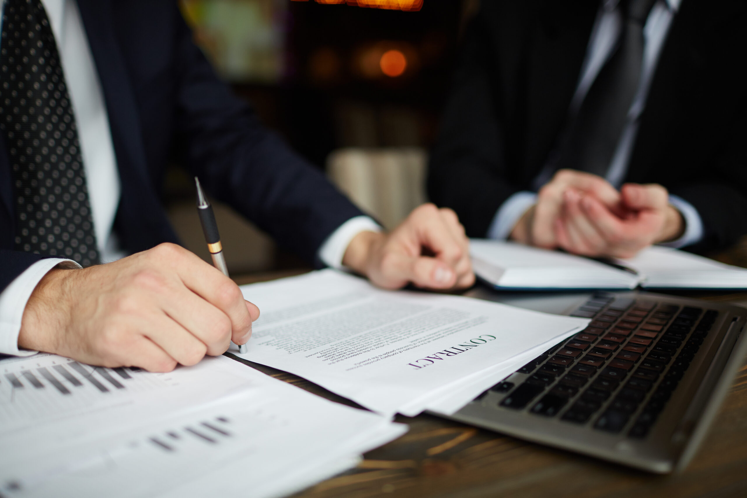 Businessman Reading Contract Closeup governing-law-